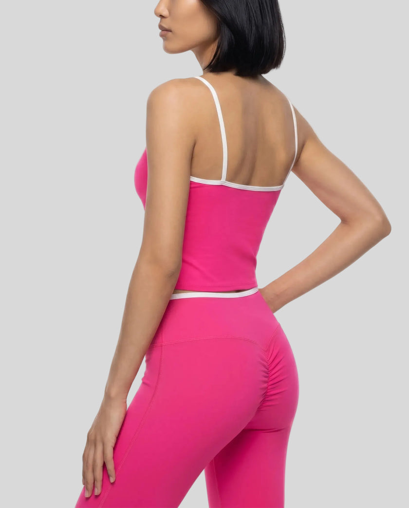 Angled back view of the TrackLine Color Block Tank paired with TrackLine Sculpt Leggings