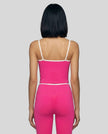 Back view of the TrackLine Color Block Tank in black and white, showing the shoulder strap design