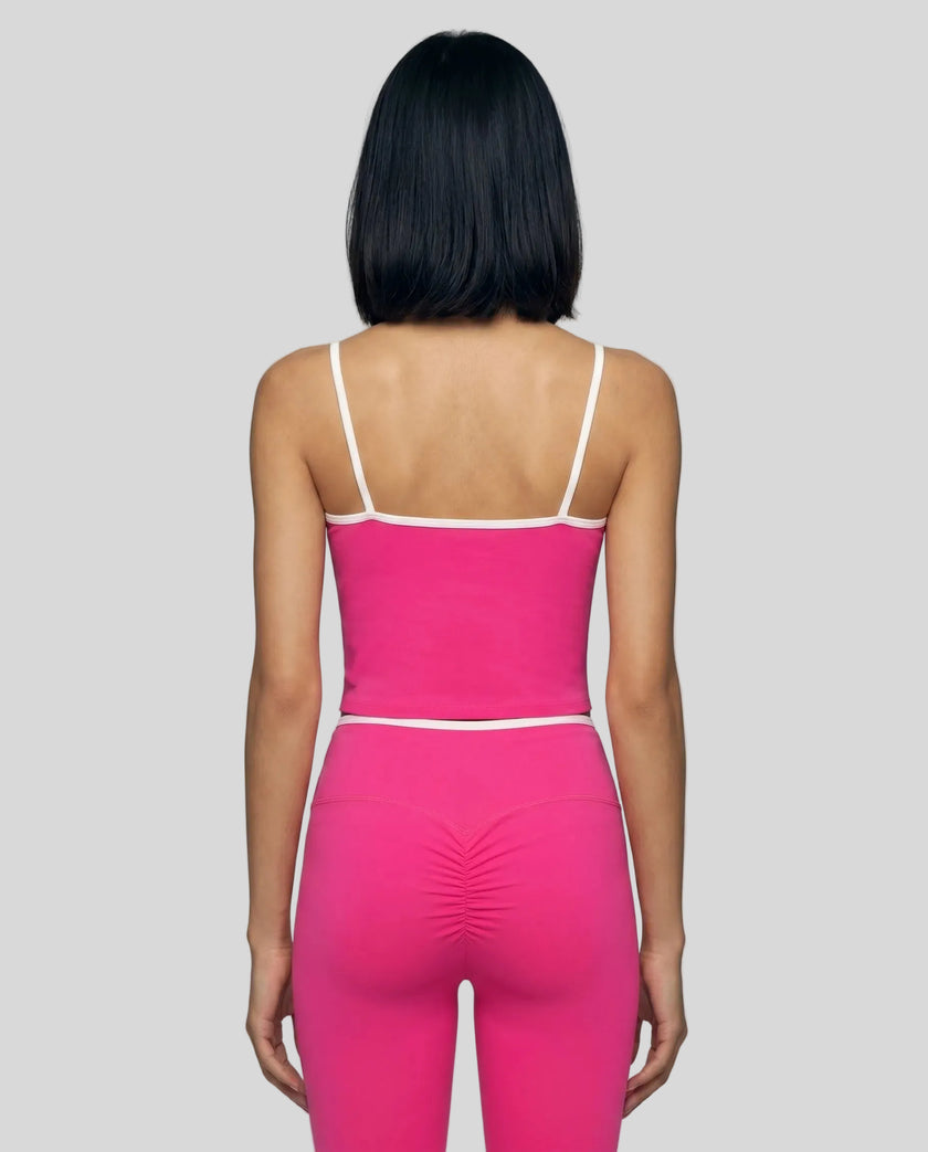 Back view of the TrackLine Color Block Tank in black and white, showing the shoulder strap design