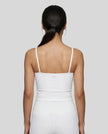 Back view of the TrackLine Color Block Tank in white, showing the shoulder strap design