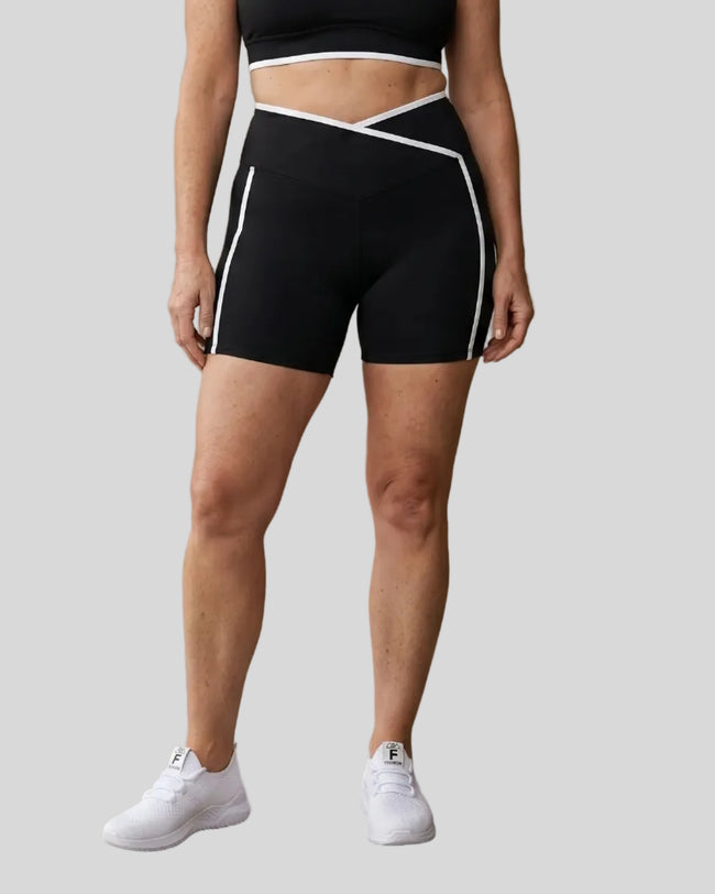 Model wearing the Large TrackLine Color Block Yoga Shorts in Black and White front view