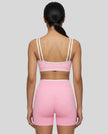 Back view of the TrackLine Color Block Yoga Shorts in Light Pink and White