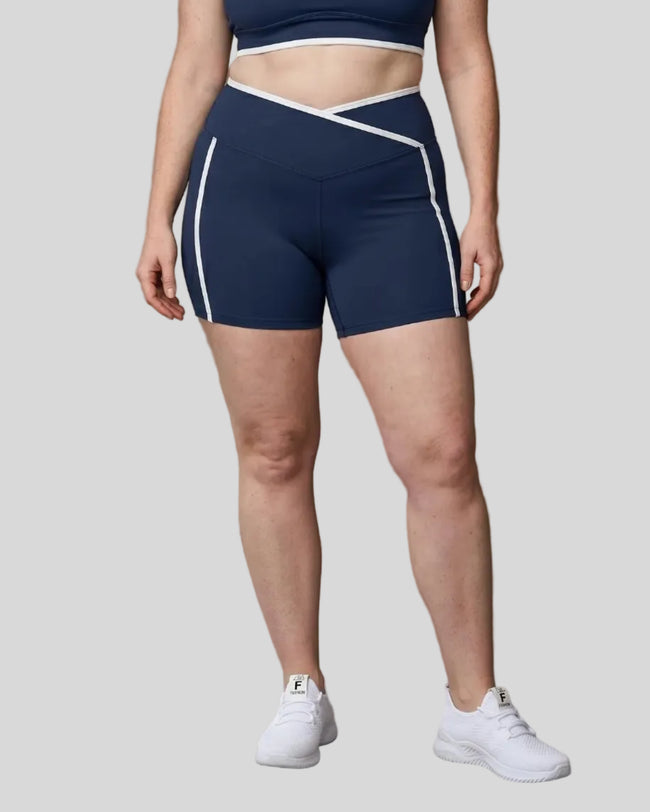 Model wearing the X-Large TrackLine Color Block Yoga Shorts in Navy Blue and White front view
