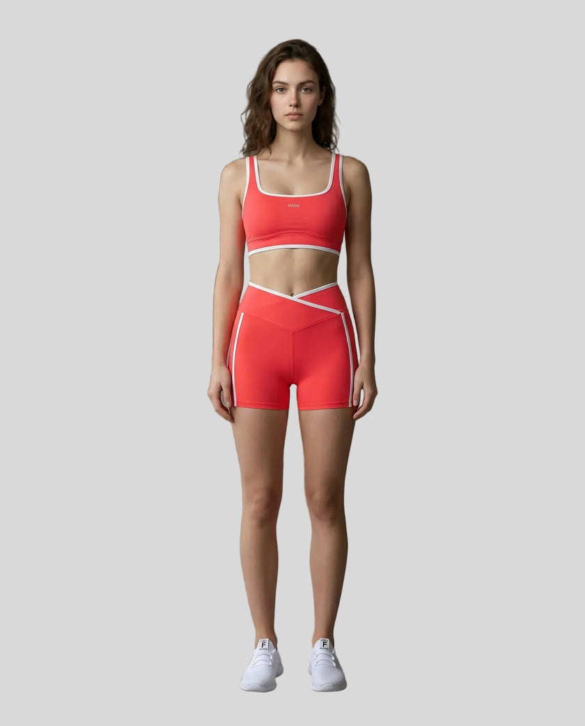 Model wearing the TrackLine Color Block Yoga Shorts in Red and White full body front view