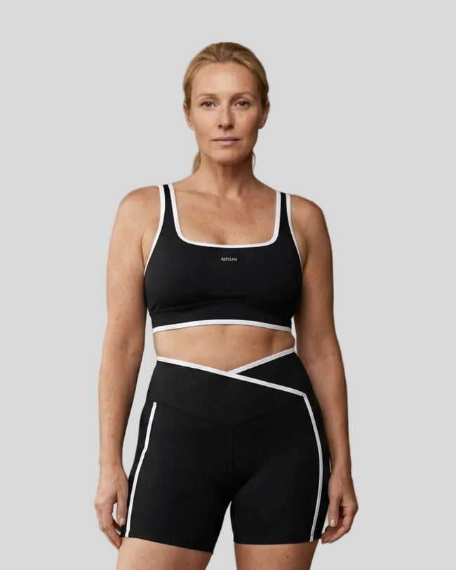 Model wearing the large-size Color Block Yoga Sports Bra in Black and White front view