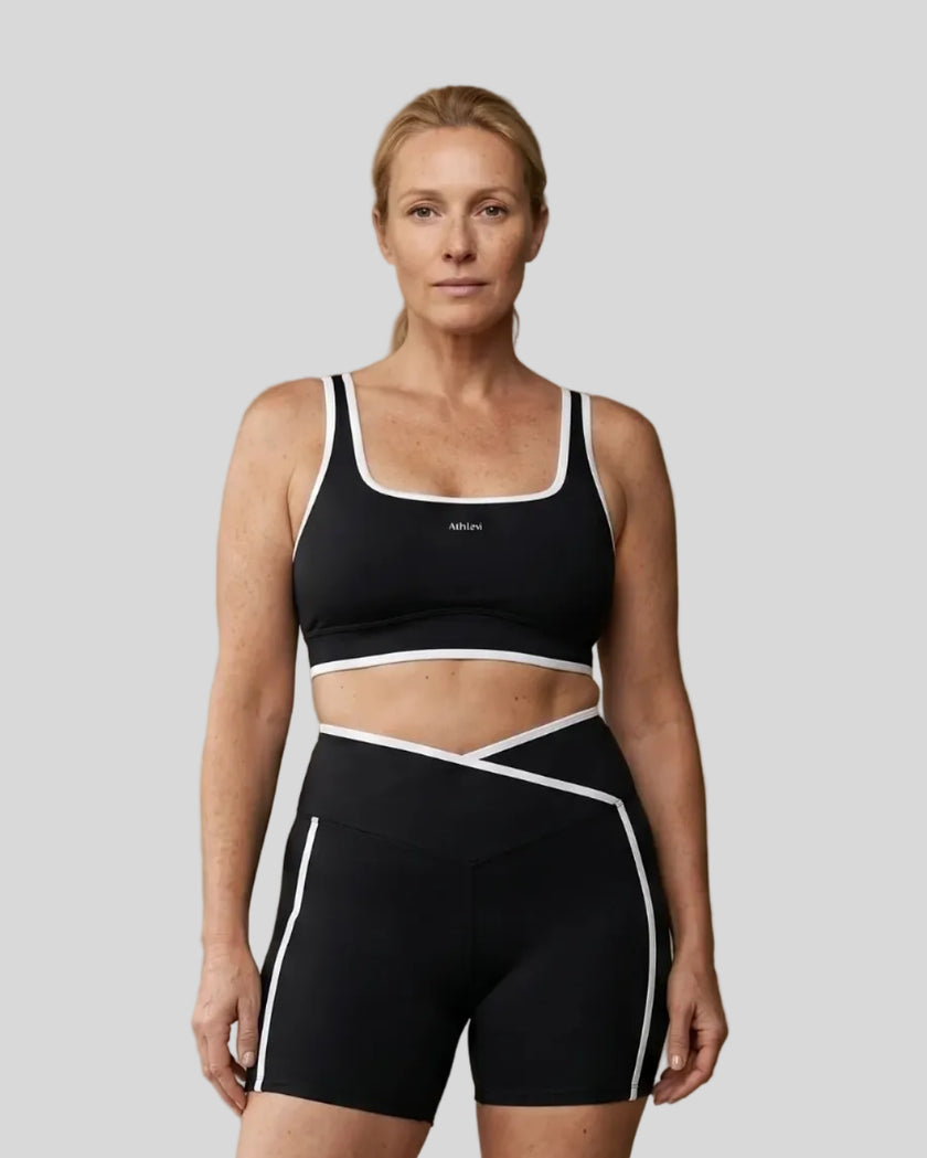 Model wearing the large-size Color Block Yoga Sports Bra in Black and White front view