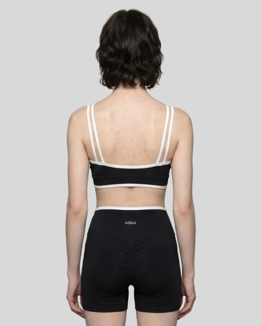 Back view of the small-size TrackLine Color Block Yoga Sports Bra in Black and White