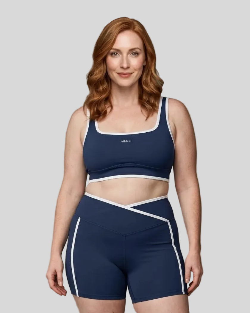 Model wearing the xlarge-size Color Block Yoga Sports Bra in Navy Blue and White front view