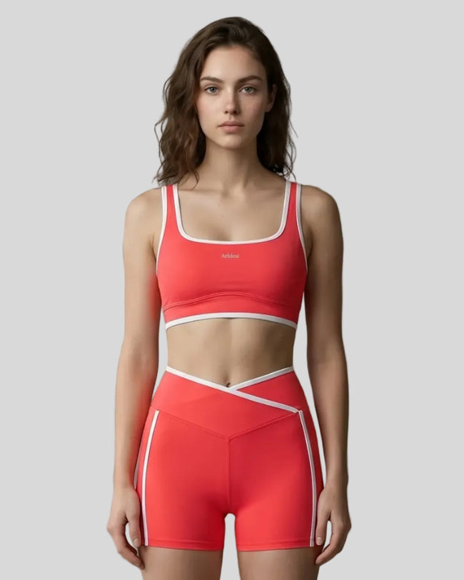 Model wearing the TrackLine Color Block Yoga Sports Bra in Red and White front view