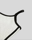 Armhole and contour binding detail closeup of the Athlesi TrackLine Contour Dress in oat gray