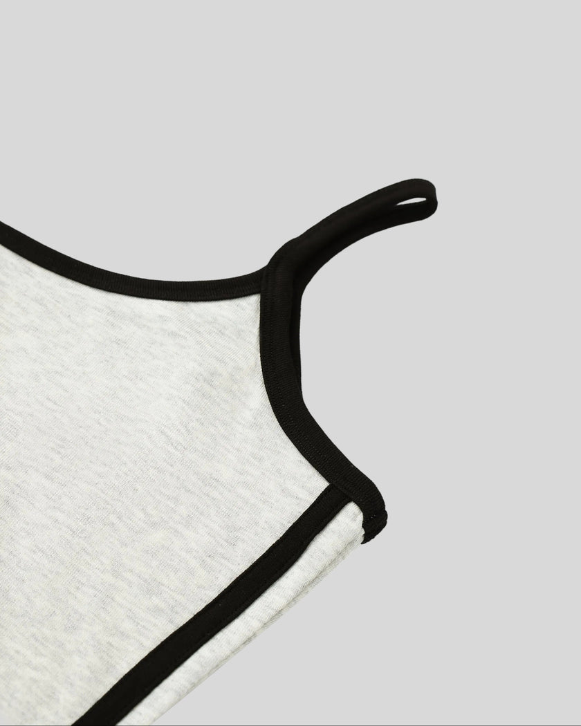 Armhole and contour binding detail closeup of the Athlesi TrackLine Contour Dress in oat gray