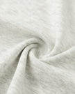 Closeup of the stretch knit fabric on the Athlesi TrackLine Contour Dress in oat gray