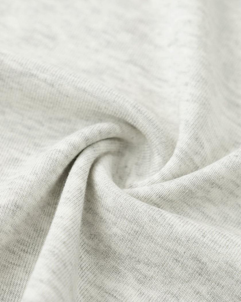 Closeup of the stretch knit fabric on the Athlesi TrackLine Contour Dress in oat gray