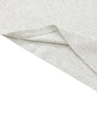 Hem detail closeup of the Athlesi TrackLine Contour Dress in oat gray