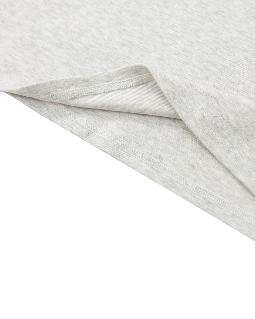 Hem detail closeup of the Athlesi TrackLine Contour Dress in oat gray