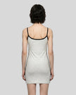 Back view of a woman wearing the Athlesi TrackLine Contour Dress in oat gray