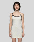 Mid body front view of a woman wearing the Athlesi TrackLine Contour Dress in oat gray