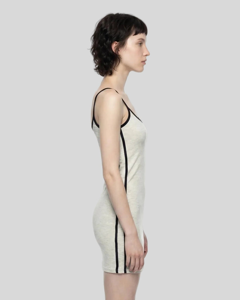 Side view of a woman wearing the Athlesi TrackLine Contour Dress in oat gray