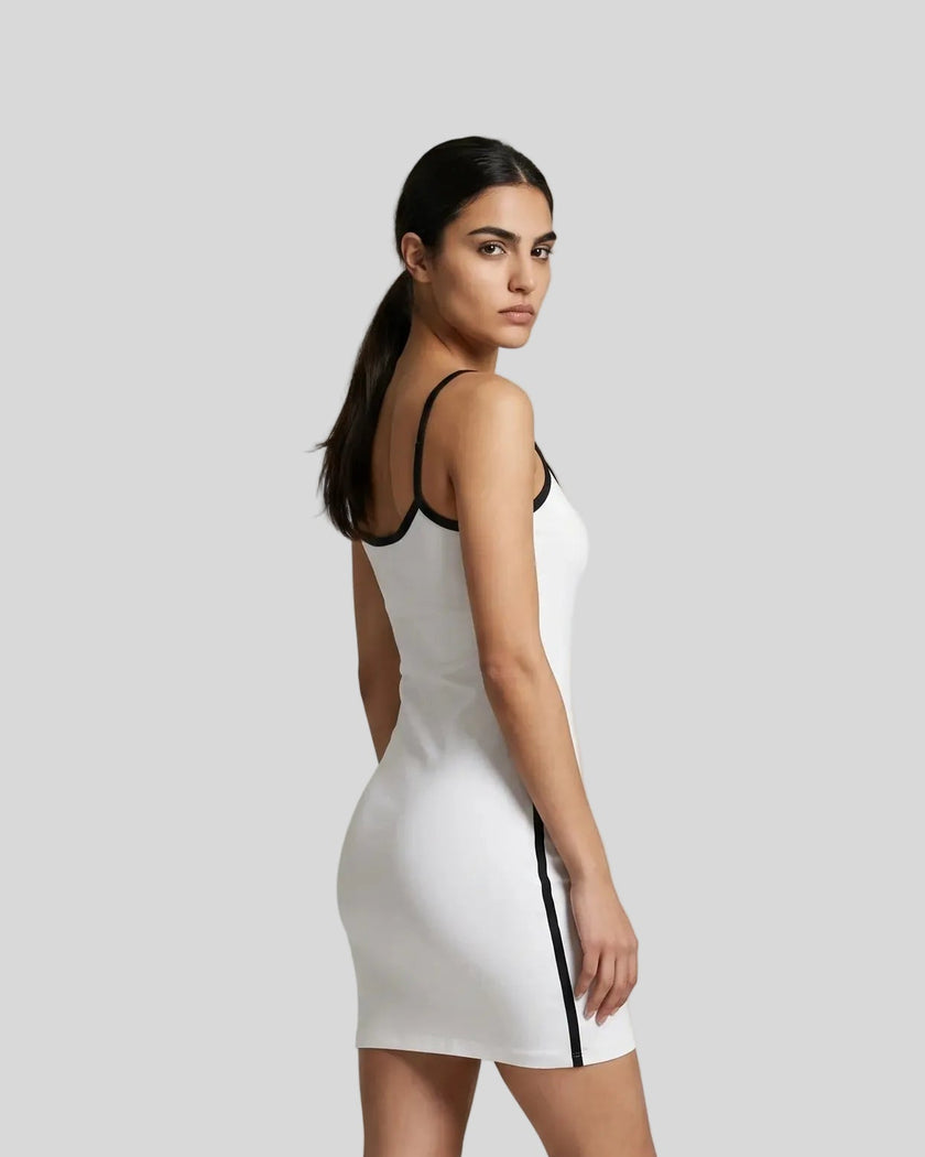 Back angle view of a woman wearing the Athlesi TrackLine Contour Dress in white