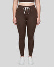 Model wearing the TrackLine Contour Yoga Leggings in Coffee, front view