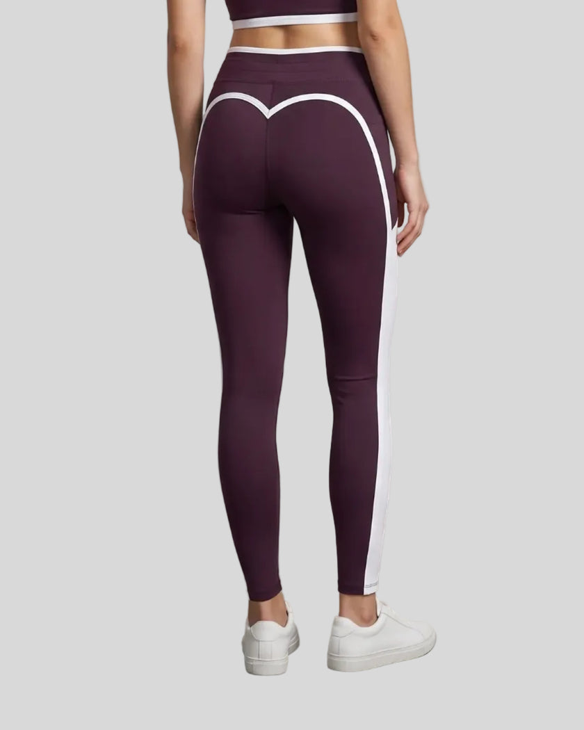 Model wearing the TrackLine Contour Yoga Leggings in Deep Purple, back view