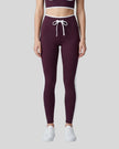 Model wearing the TrackLine Contour Yoga Leggings in Deep Purple, front view
