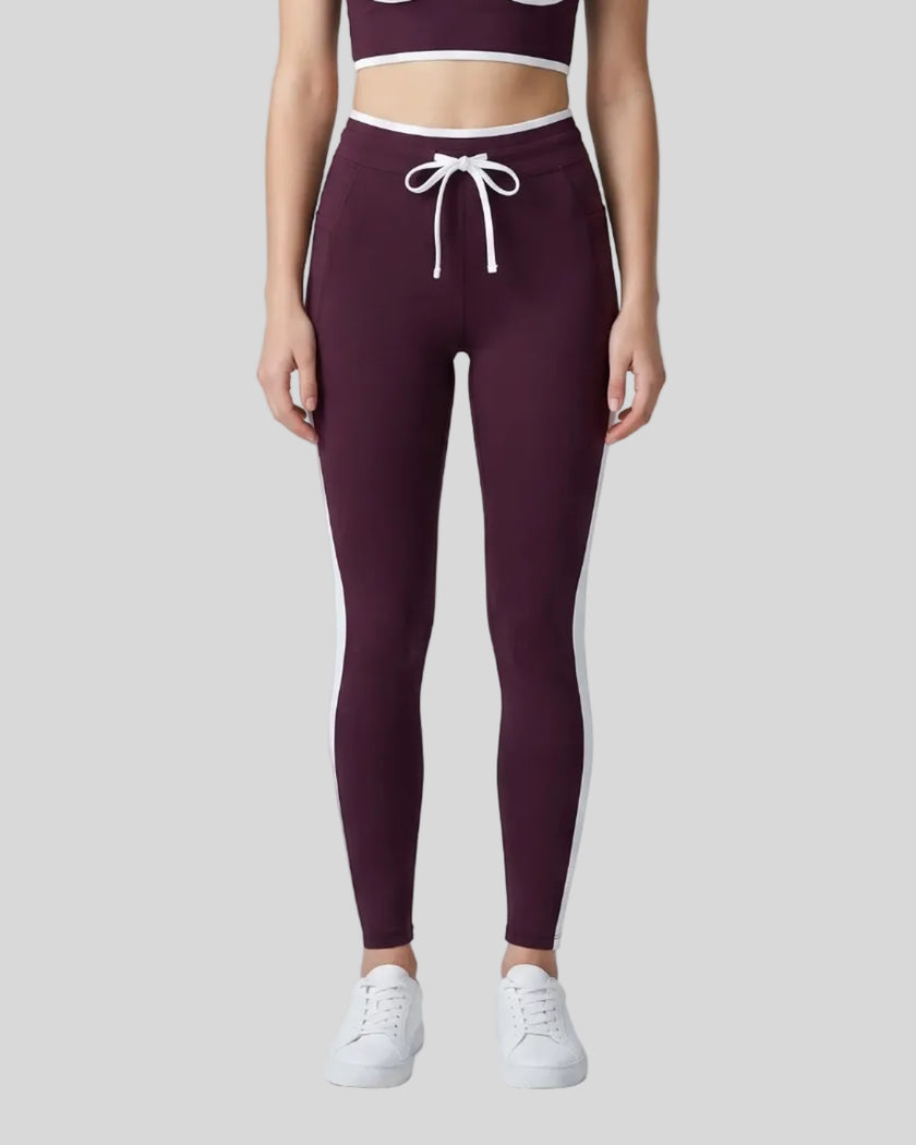 Model wearing the TrackLine Contour Yoga Leggings in Deep Purple, front view