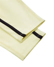 Closeup of the tapered leg opening on the TrackLine Contour Yoga Leggings in Light Yellow (White)