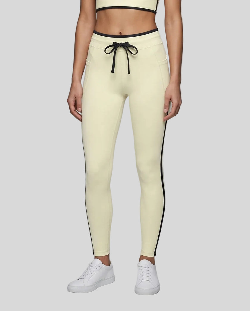 Model wearing the TrackLine Contour Yoga Leggings in Light Yellow (White), front view