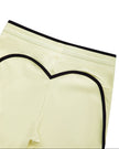 Closeup of the back waistband and contour seam detail on the TrackLine Contour Yoga Leggings in Light Yellow (White)