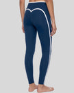 Model wearing the TrackLine Contour Yoga Leggings in Navy Blue, back angle view