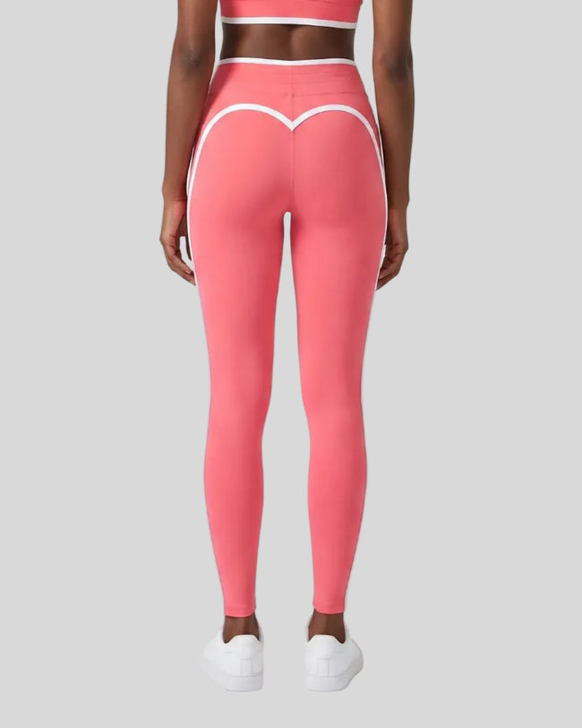 Model wearing the TrackLine Contour Yoga Leggings in Pink, back view