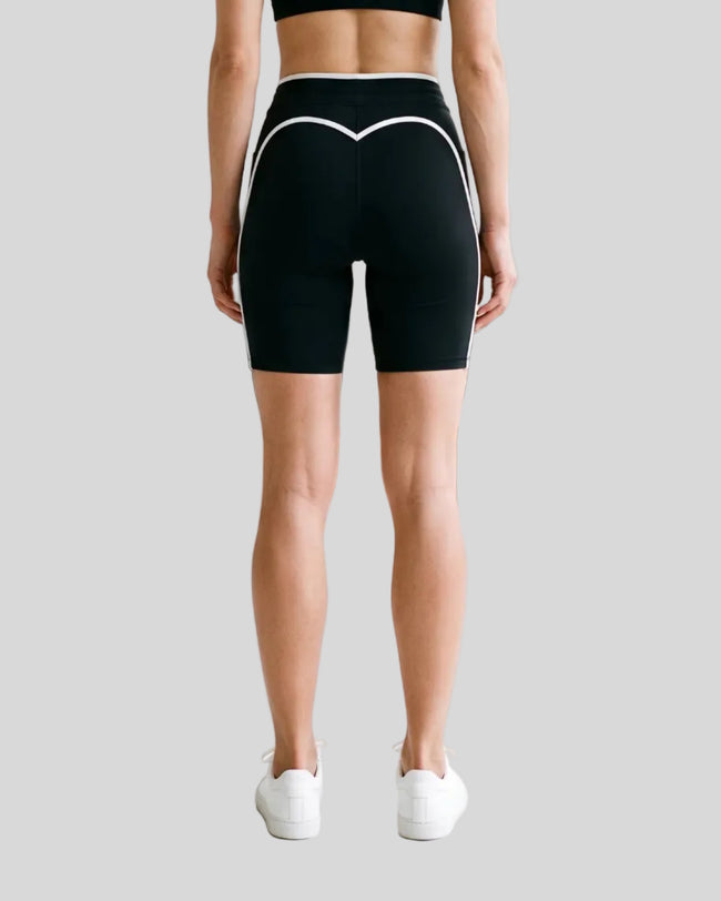 Model wearing the TrackLine Contour Yoga Shorts in Black, back view
