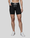 Model wearing the TrackLine Contour Yoga Shorts in Black, front view