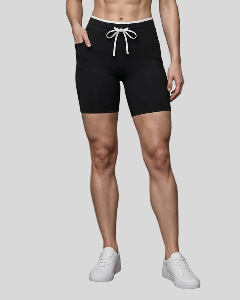Model wearing the TrackLine Contour Yoga Shorts in Black, front view