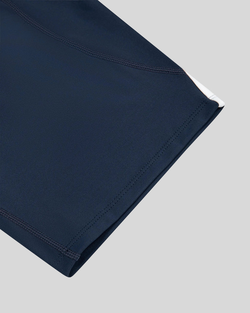 Closeup of the leg opening and hem detail on the TrackLine Contour Yoga Shorts in Navy Blue