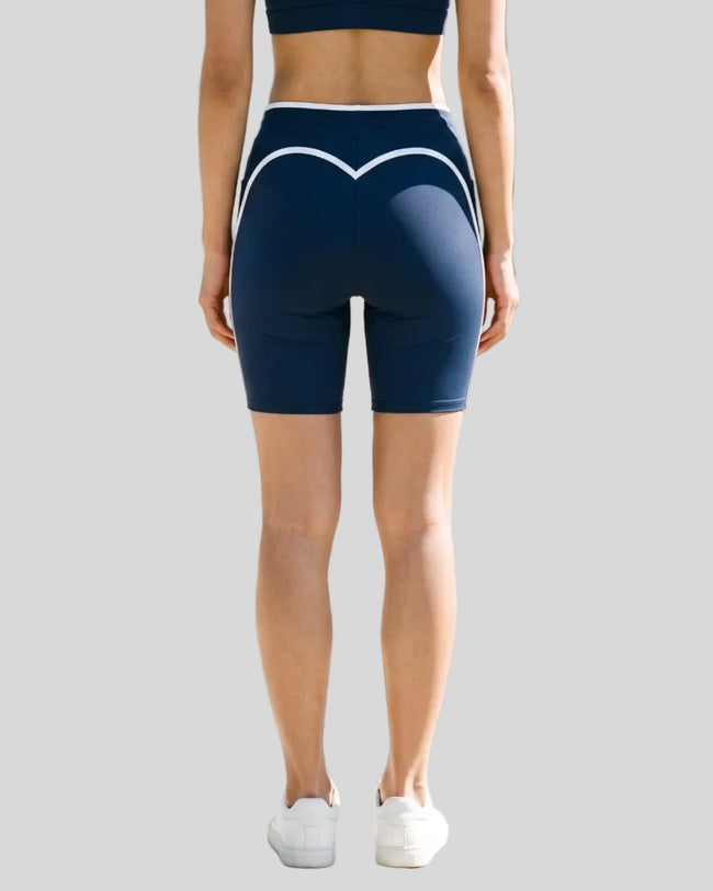 Model wearing the TrackLine Contour Yoga Shorts in Navy Blue, back view