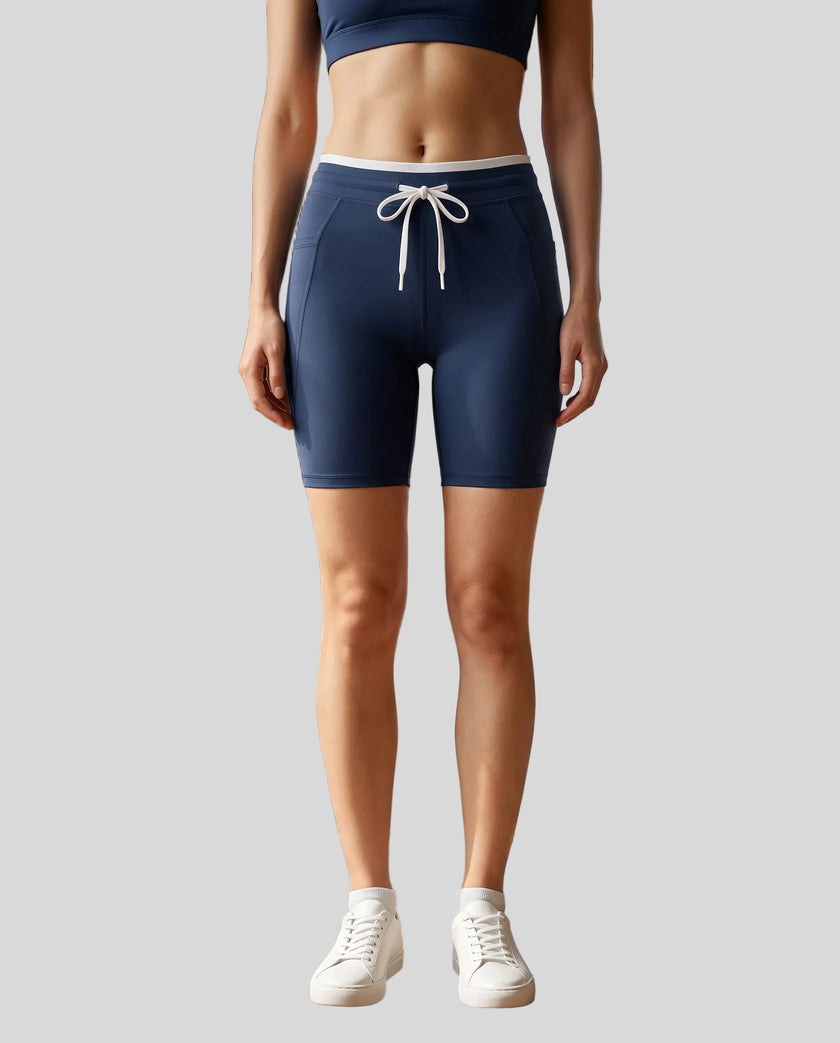 Model wearing the TrackLine Contour Yoga Shorts in Navy Blue, front view