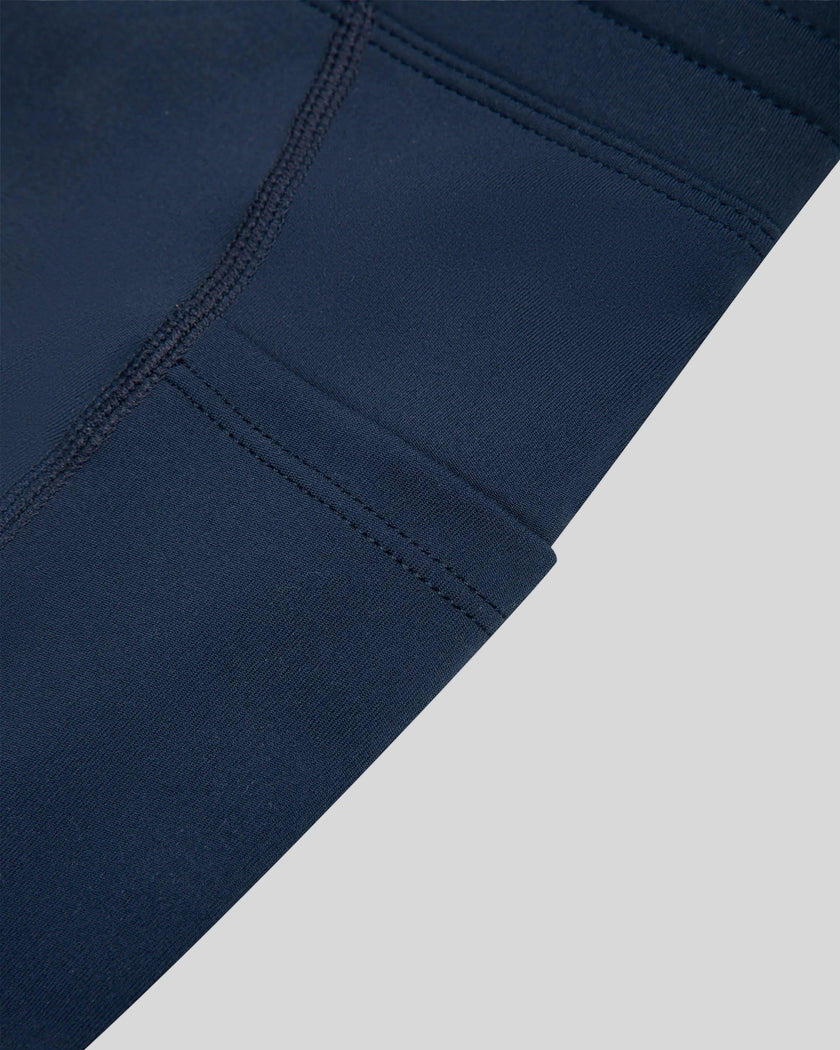 Closeup of the side pocket and contour piping on the TrackLine Contour Yoga Shorts in Navy Blue