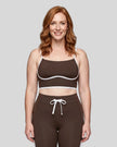 Model wearing the TrackLine Contour Yoga Sports Bra in Coffee, front view