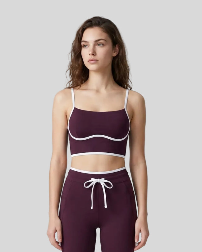 Model wearing the TrackLine Contour Yoga Sports Bra in Deep Purple, front view