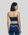 Model wearing the TrackLine Contour Yoga Sports Bra in Navy Blue, back view