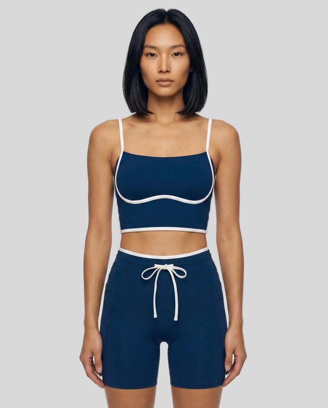 Model wearing the TrackLine Contour Yoga Sports Bra in Navy Blue, front view