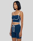 Model wearing the TrackLine Contour Yoga Sports Bra in Navy Blue, side view