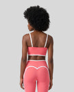 Model wearing the TrackLine Contour Yoga Sports Bra in Pink, back view