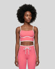 Model wearing the TrackLine Contour Yoga Sports Bra in Pink, front view
