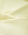 Closeup of the smooth stretch performance fabric used in the TrackLine Contour Yoga Sports Bra in White.