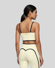 Model wearing the TrackLine Contour Yoga Sports Bra in White, back view