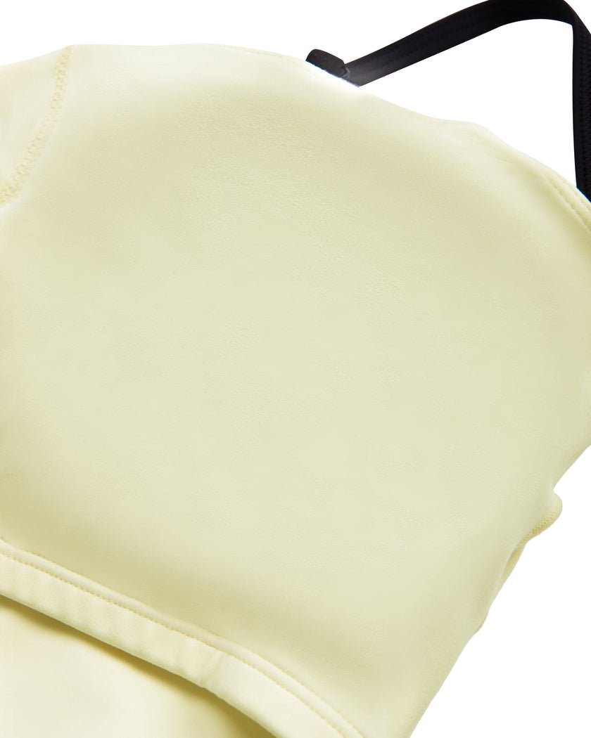 Interior removable padding detail of the TrackLine Contour Yoga Sports Bra in White.