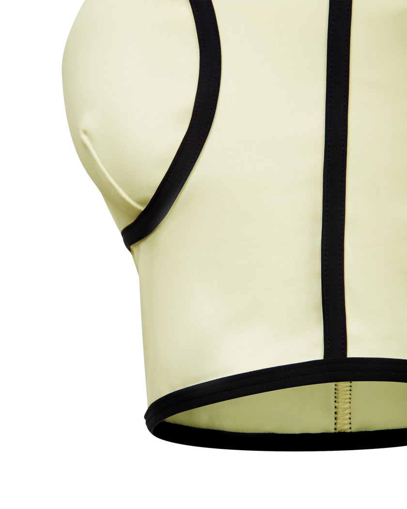 Closeup of the underbust band and contrast trim on the TrackLine Contour Yoga Sports Bra in White.